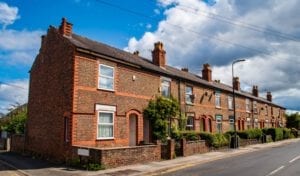 End terrace house with side garden and brick exterior