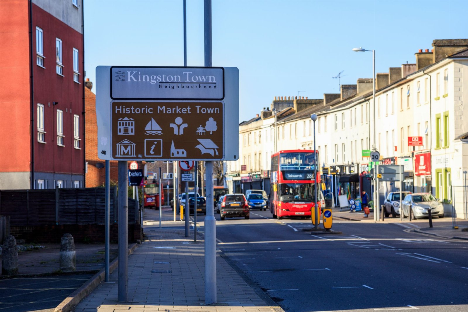 The Kingston Town sign on a high street in Kingston upon Thames